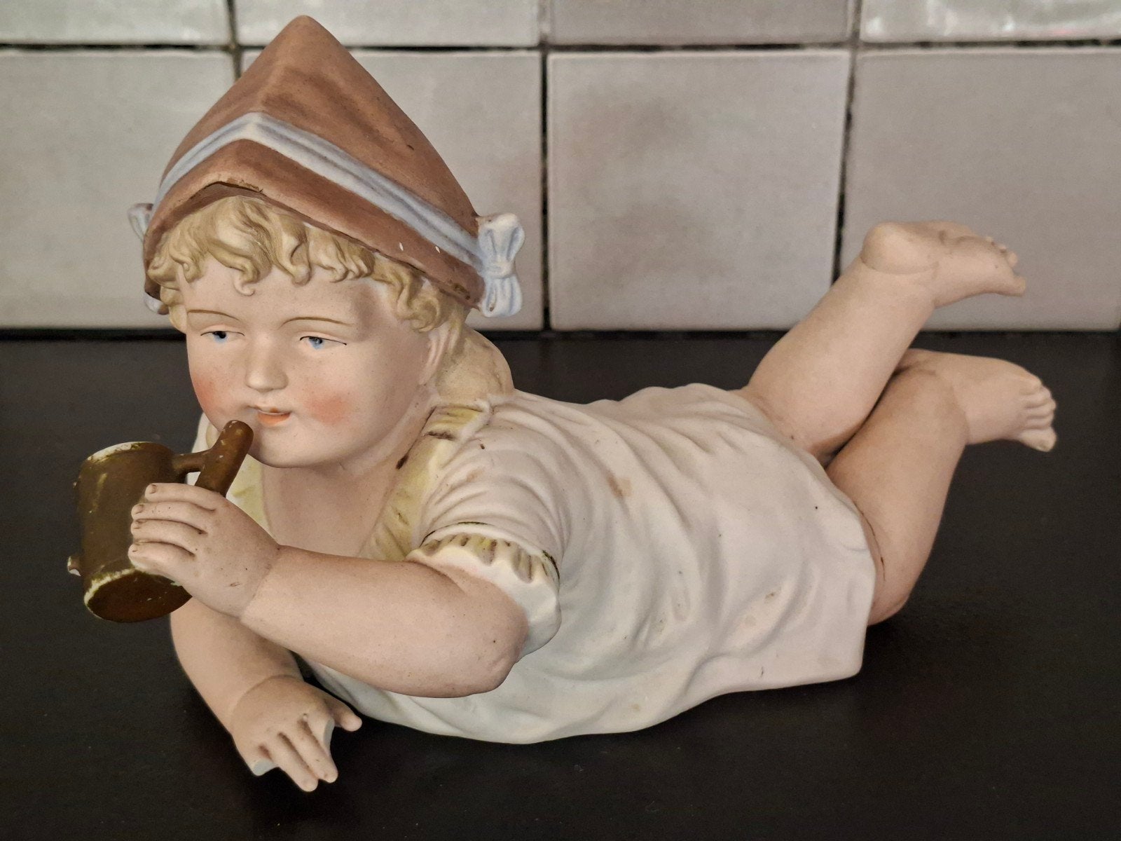 Antieke Heubach piano baby met defect, Ophalen of Verzenden