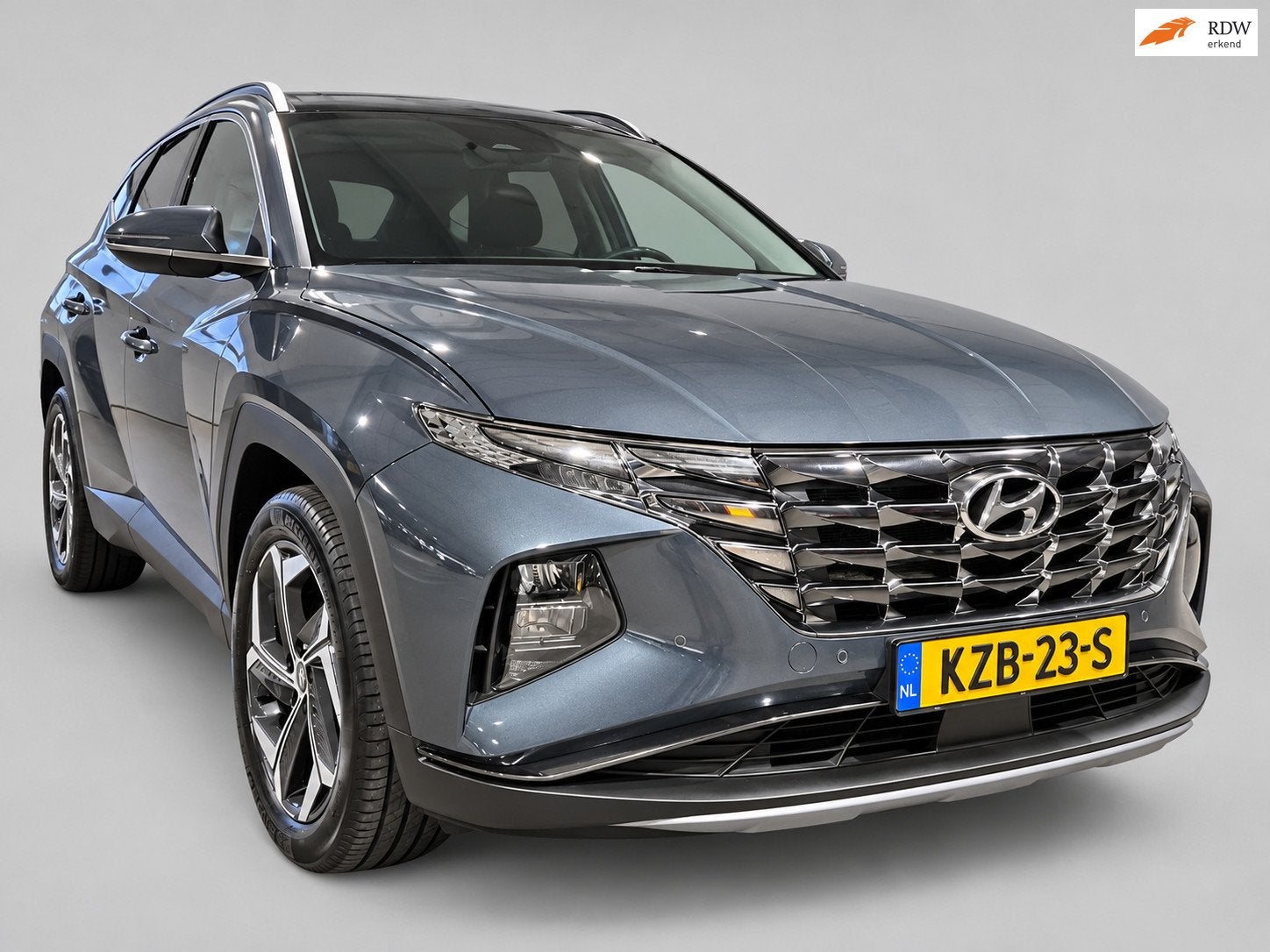 Hyundai TUCSON 1.6 T-GDI PHEV Comfort 4WD - Camera - Navigat, Auto's, Automaat, Gebruikt, 4 cilinders, Blauw