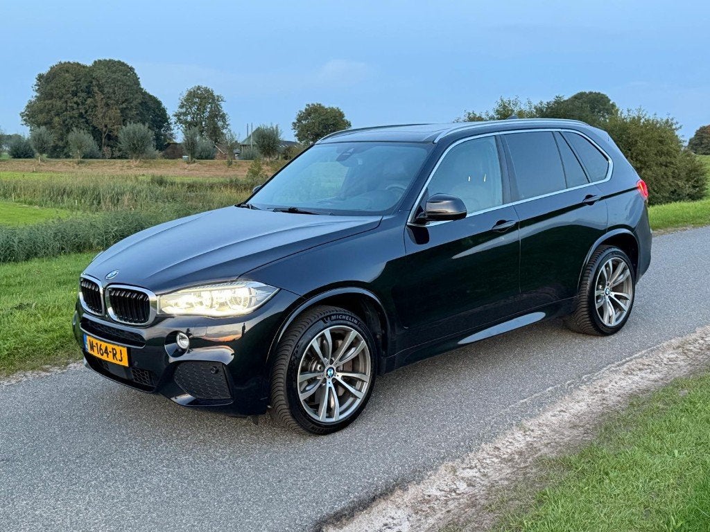 BMW X5 Xdrive50i 450pk Aut 2014 Zwart, Auto's, Automaat, 10 km/l, Bruin, Vierwielaandrijving