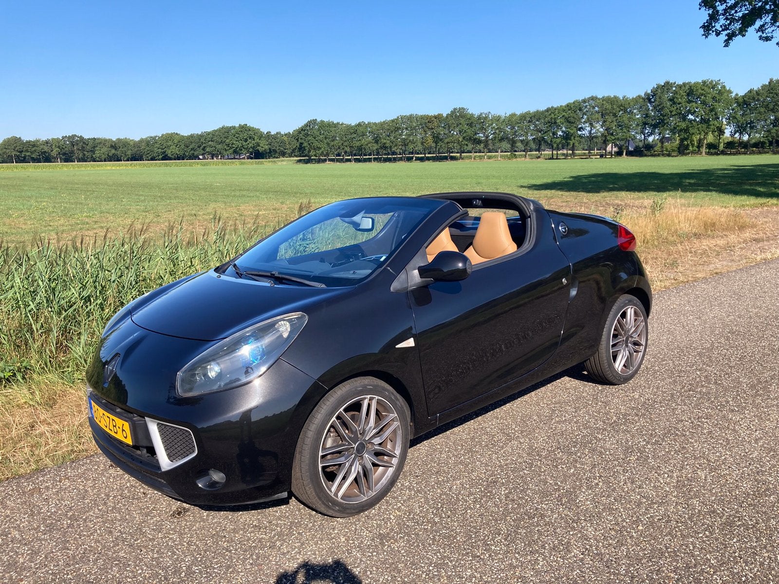 Renault Wind 1.6 16V 2012 Zwart, Auto's, Voorwielaandrijving, Dealer onderhouden, 4 cilinders, Cabriolet