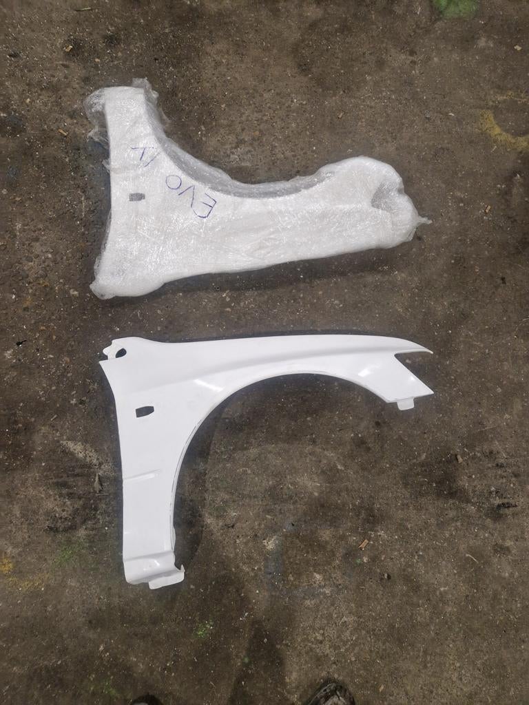 Fiberglass spatborden mitsubishi lancer evo 9, Ophalen of Verzenden, Nieuw, Mitsubishi