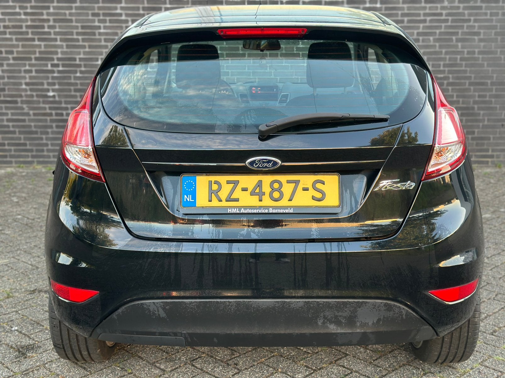 Foto 10 van Ford Fiësta 1.25 44KW 3DR 2014 Zwart/17INCH/CRPLY/NW ONDRHD