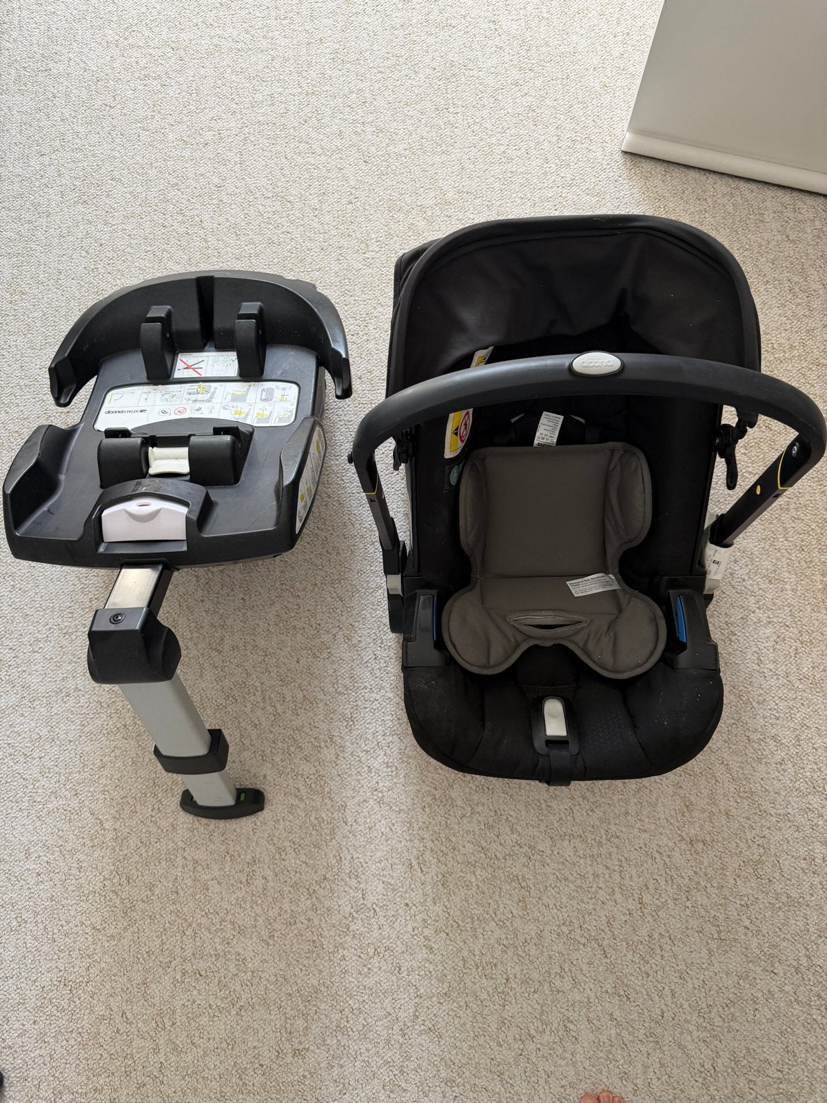 Doona autostoel met Isofix base, Gebruikt, Zijbescherming, Isofix, 0 t/m 13 kg