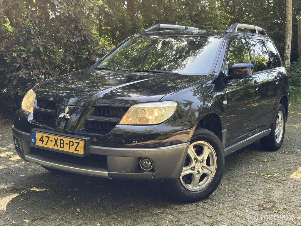 Mitsubishi Outlander Sport 2.0 Travel, Auto's, Mitsubishi, Voorwielaandrijving, Zwart, 4 cilinders, Handgeschakeld