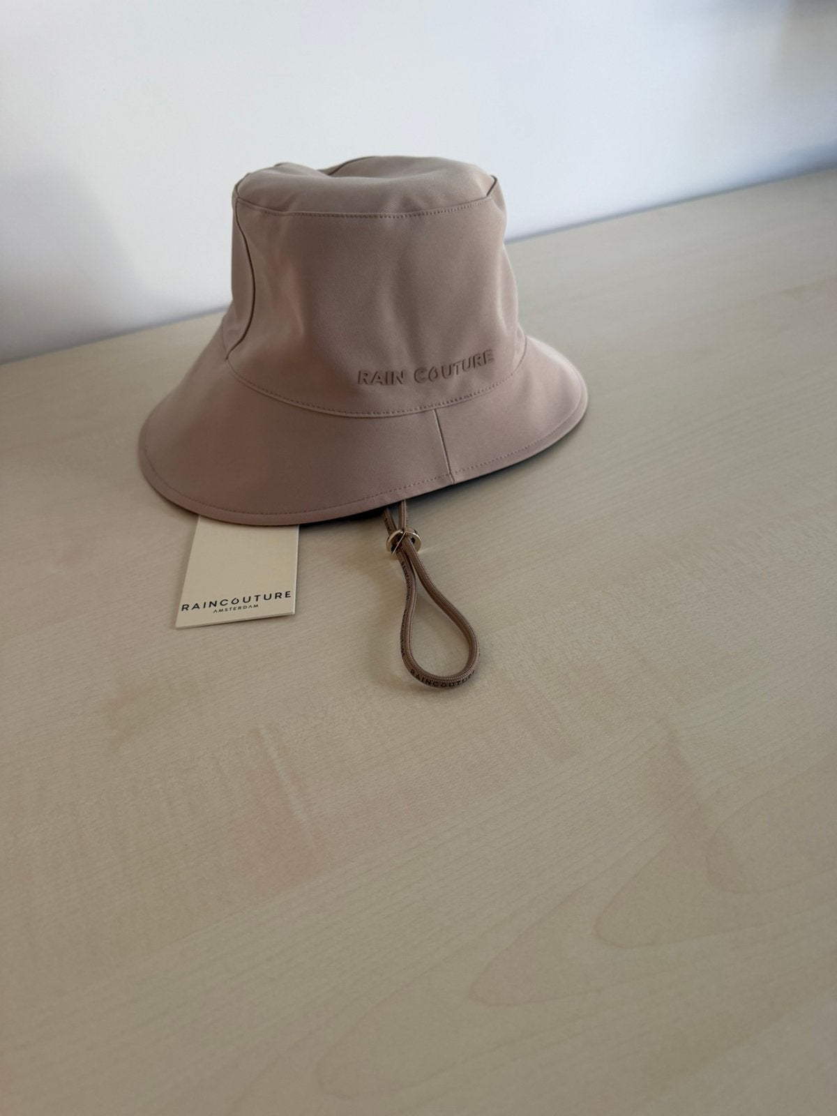 Rain Couture omkeerbare waterdichte regenhoed S – nieuw €99, Ophalen of Verzenden, Nieuw, Hoed