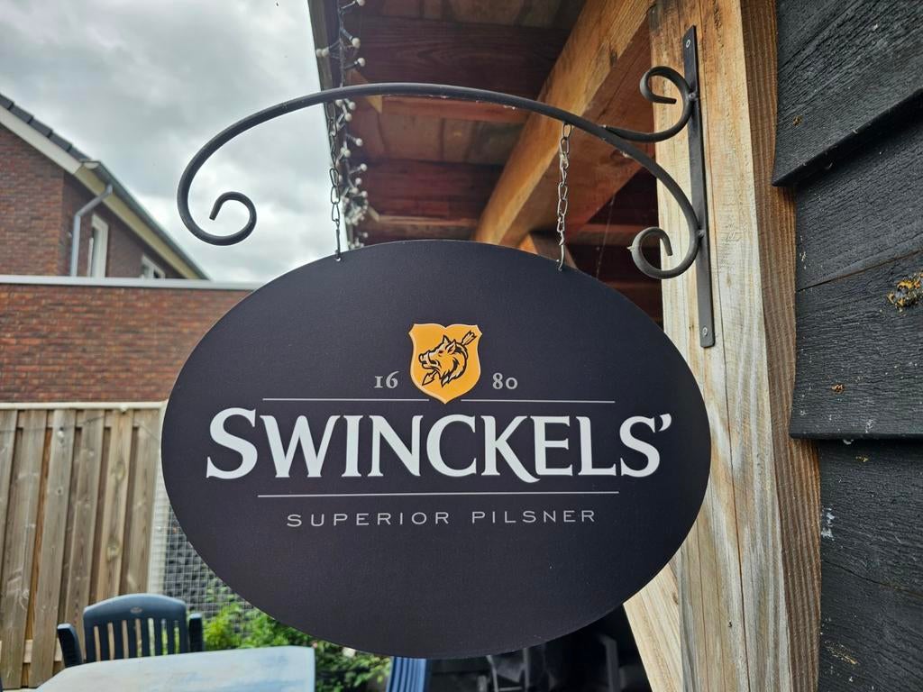 Dubbelzijdig SWINCKELS UITHANGBORD (incl. beugel), Ophalen of Verzenden, Nieuw, Reclamebord, Plaat of Schild, Overige merken
