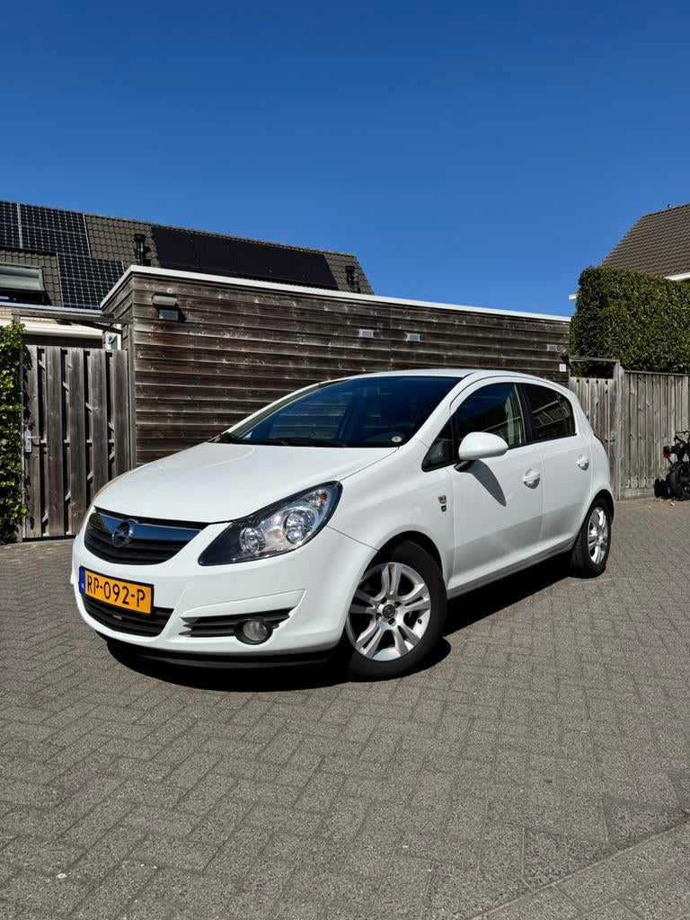 Opel Corsa 1.2 Ecoflex 5D 2010 Wit, Auto's, 4 cilinders, 1229 cc, Handgeschakeld, 19 km/l