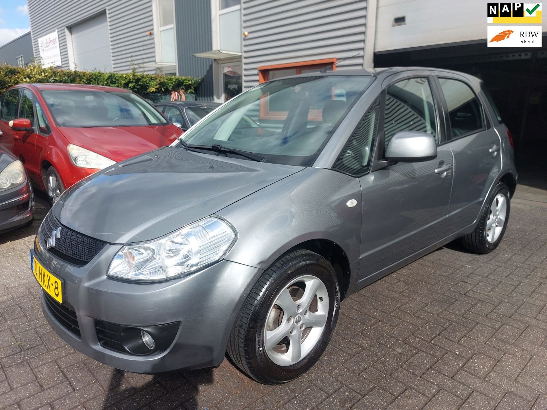 Suzuki SX4 1.6 Exclusive 5 deurs + geregelde airco, Voorwielaandrijving, Gebruikt, Metallic lak, 4 cilinders