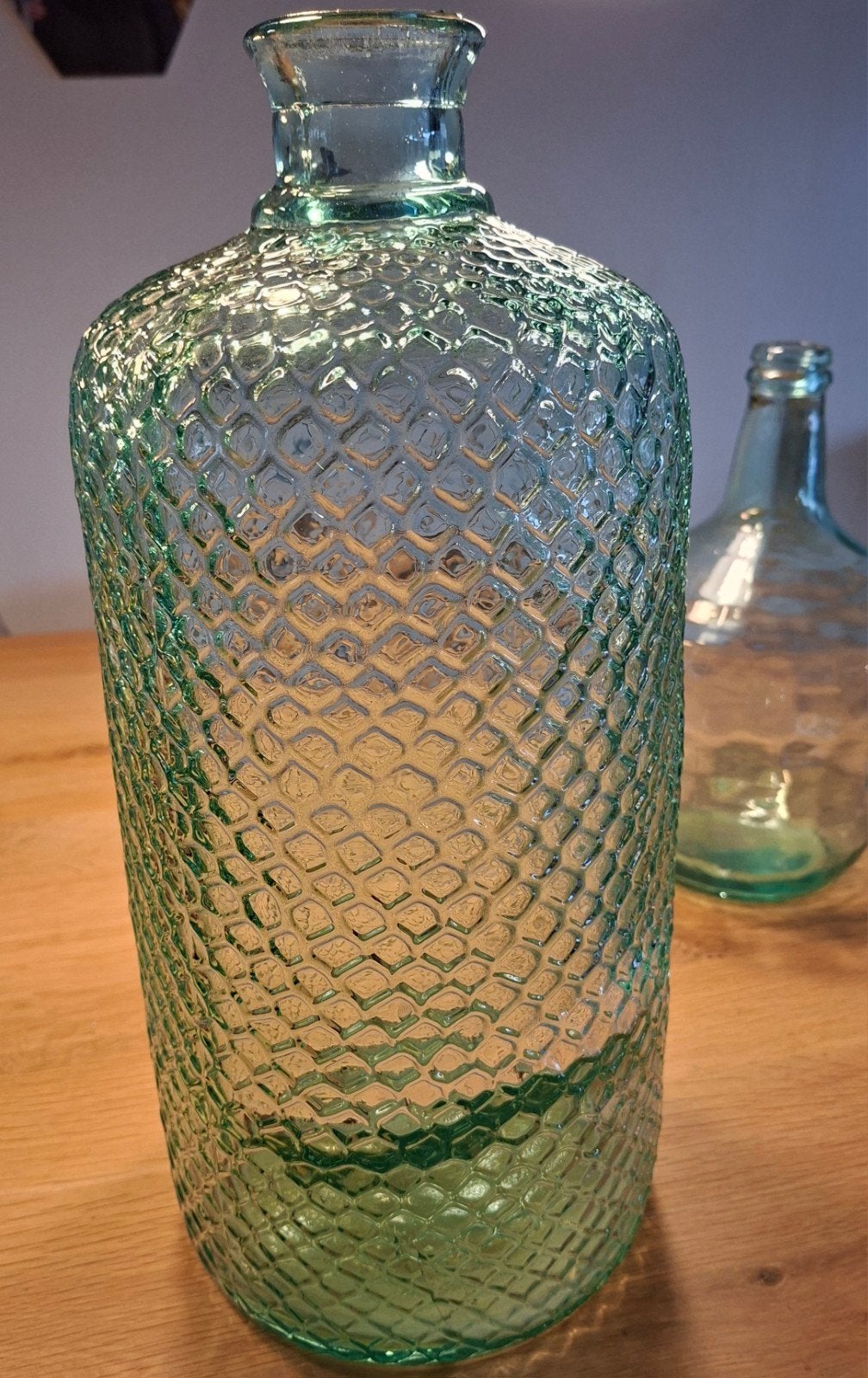 Zware groene fles, Ophalen