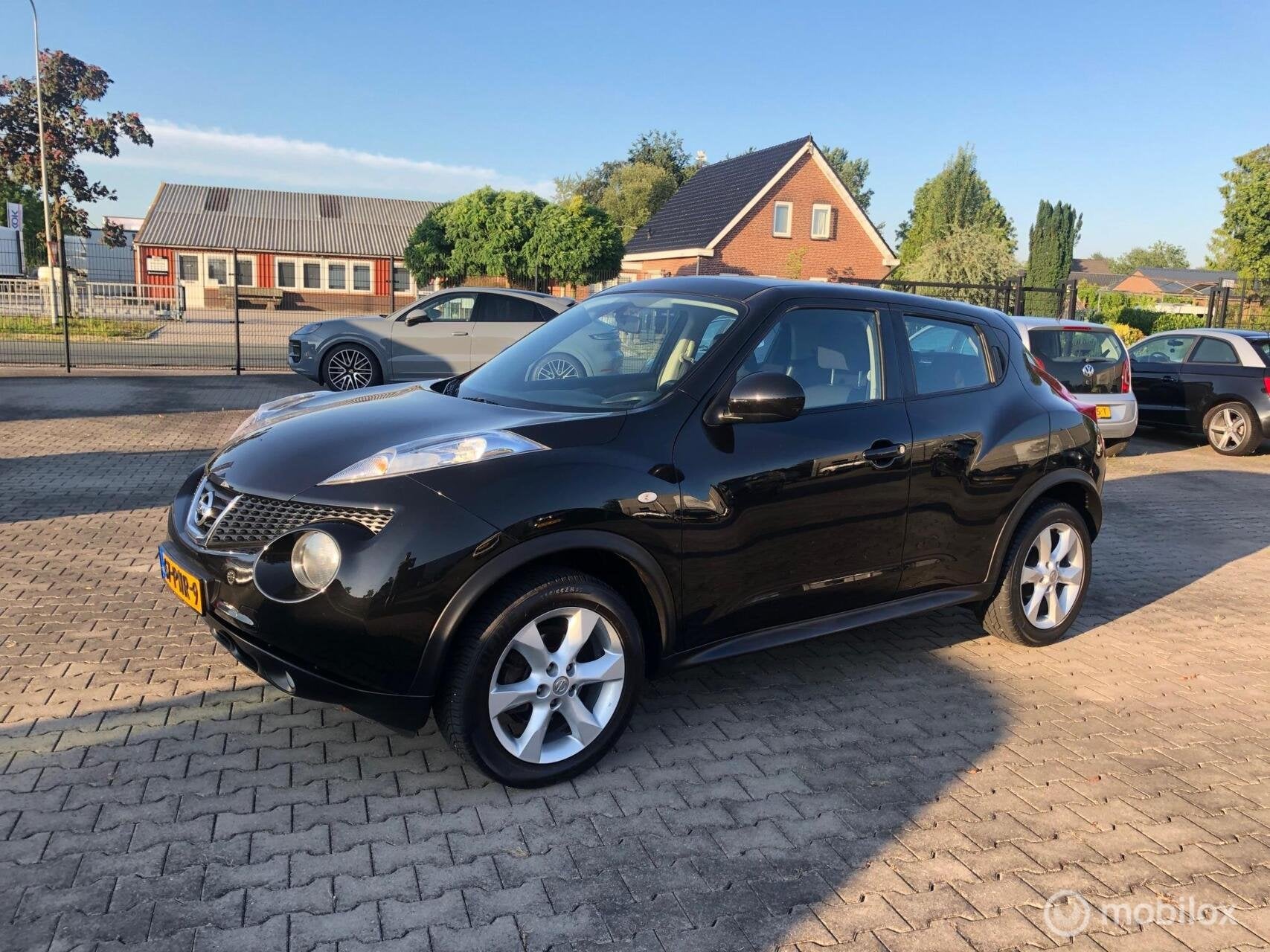 Nissan Juke 1.6 CRUISE ECC NAVI CAMERA LMV, Auto's, Nissan, Euro 5, Stof, Zwart, 4 cilinders