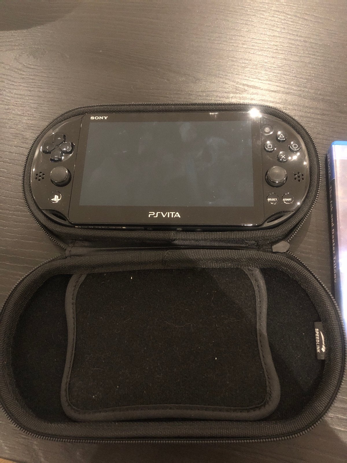 Sony PS Vita met The Jak and Daxter Trilogy en hoes, Ophalen of Verzenden, Zo goed als nieuw, Zwart, Met games