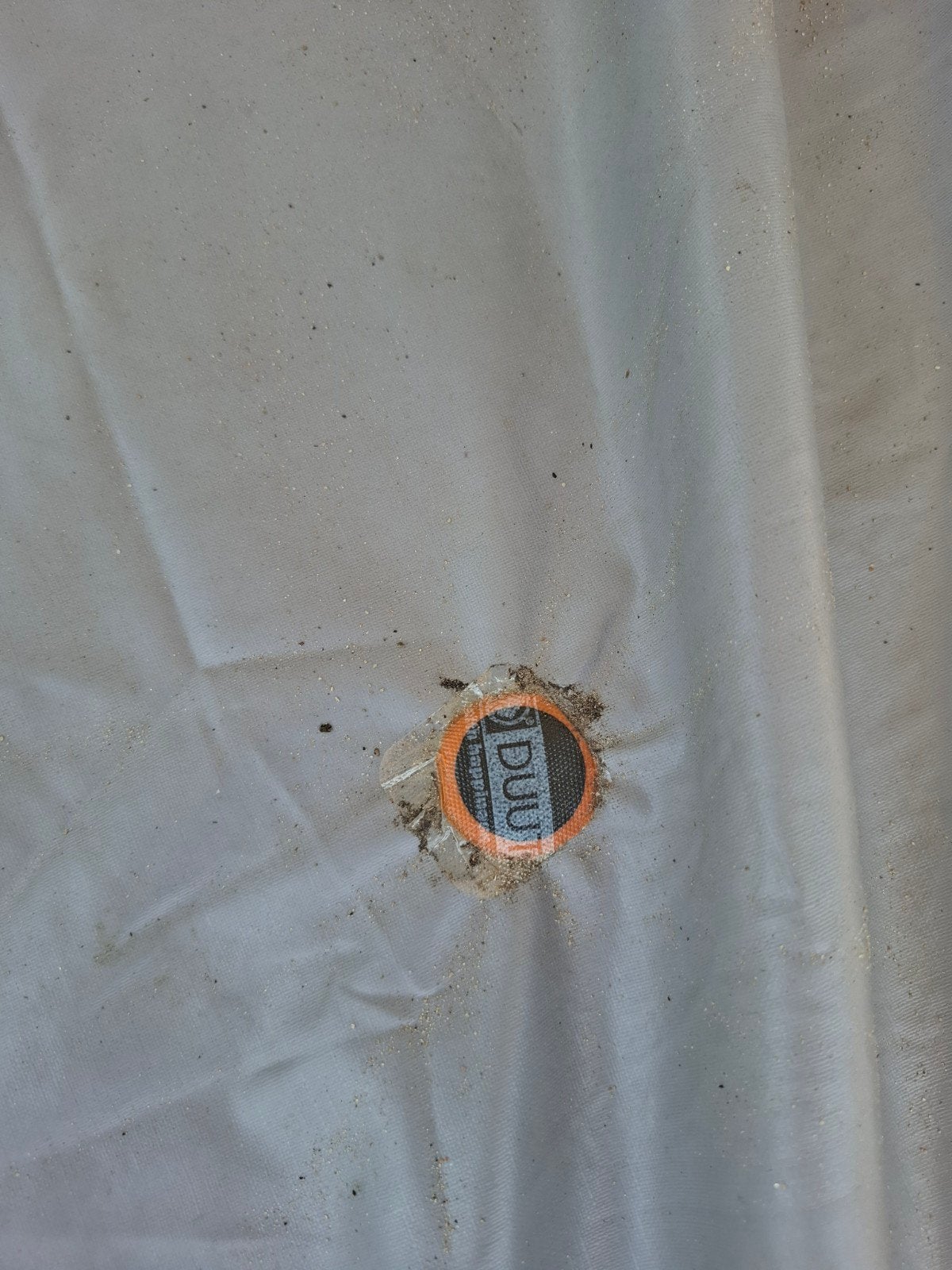 Rubber kleed voor voortent, Ophalen