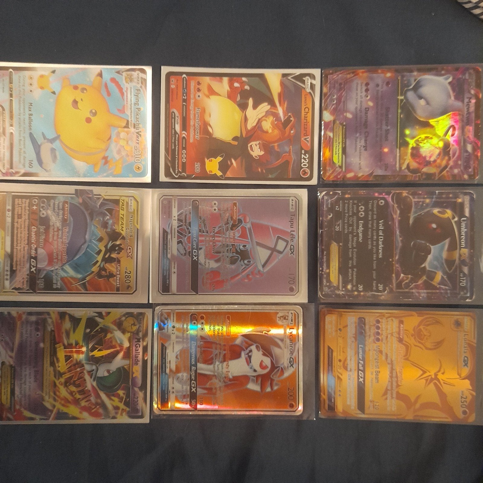 9 Pokémon kaarten, waaronder Charizard V en Pikachu VMAX, Ophalen of Verzenden, Zo goed als nieuw, Meerdere kaarten, Foil