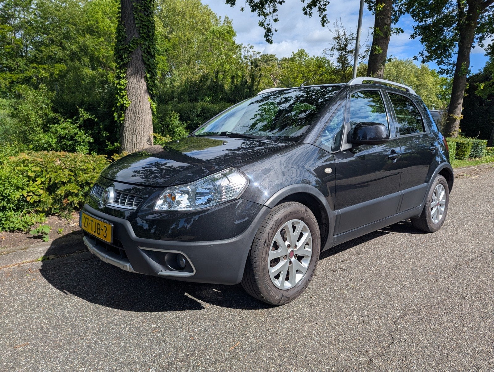Fiat Sedici 1.6 16V 2WD 2012 Zwart, Auto's, Voorwielaandrijving, Stof, Zwart, 4 cilinders