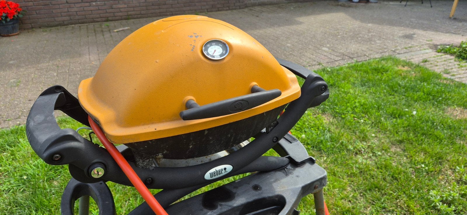 Weber Q 1200 Oranje Gasbarbecue met Onderstel, Ophalen of Verzenden, Gebruikt, Weber