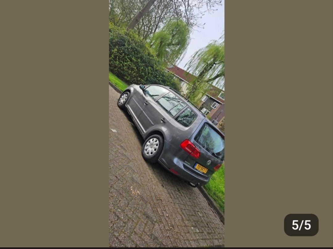 Volkswagen Touran 1.2 TSI 77KW BMT 7P 2012 Grijs, Voorwielaandrijving, 4 cilinders, 7 stoelen, Origineel Nederlands