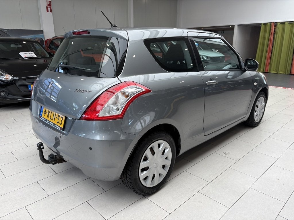 Suzuki Swift 1.2 Comfort [ TREKHAAK I ALL SEASON I STOELVERW, Auto's, Stof, Gebruikt, Swift, Origineel Nederlands