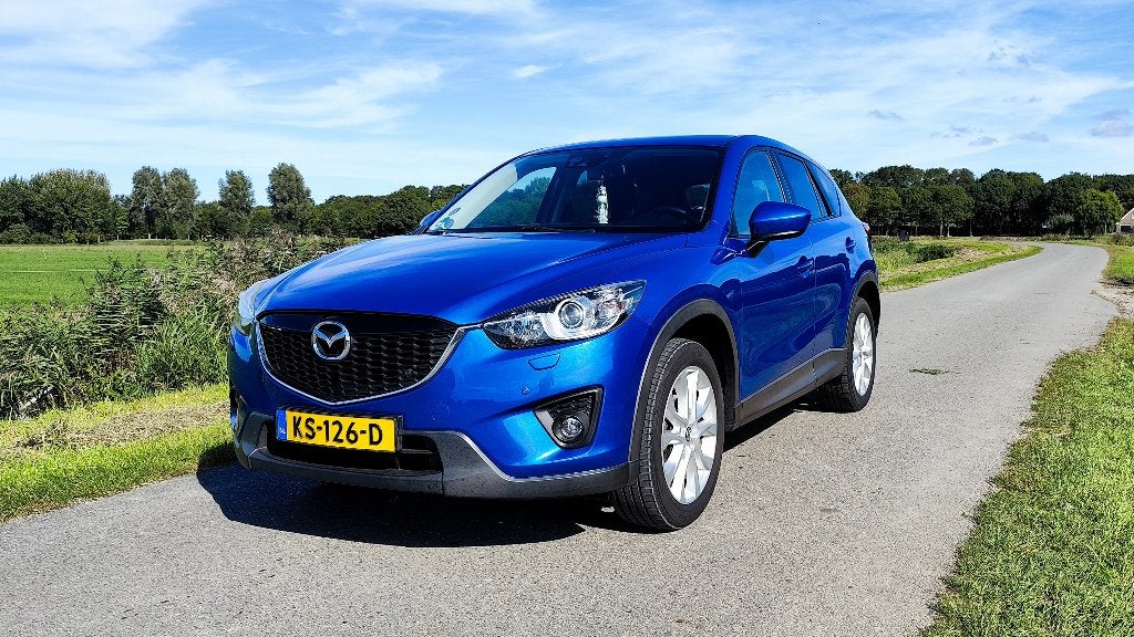 Mazda CX-5 2.0 Skyactiv-g 160pk 4WD Aut 2012 Blauw, Automaat, 1800 kg, Zwart, 4 cilinders