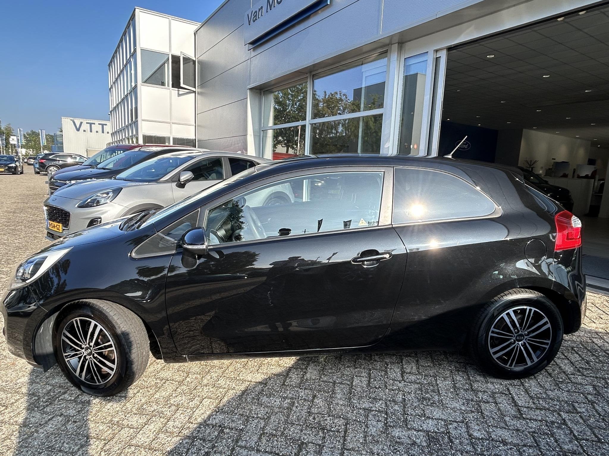 Kia Rio 1.2 CVVT Plus Pack, Auto's, 4 cilinders, Zwart, Origineel Nederlands, Handgeschakeld