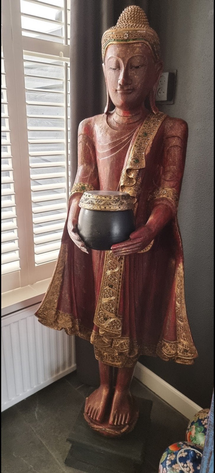 levensgroot houten boedha, Ophalen