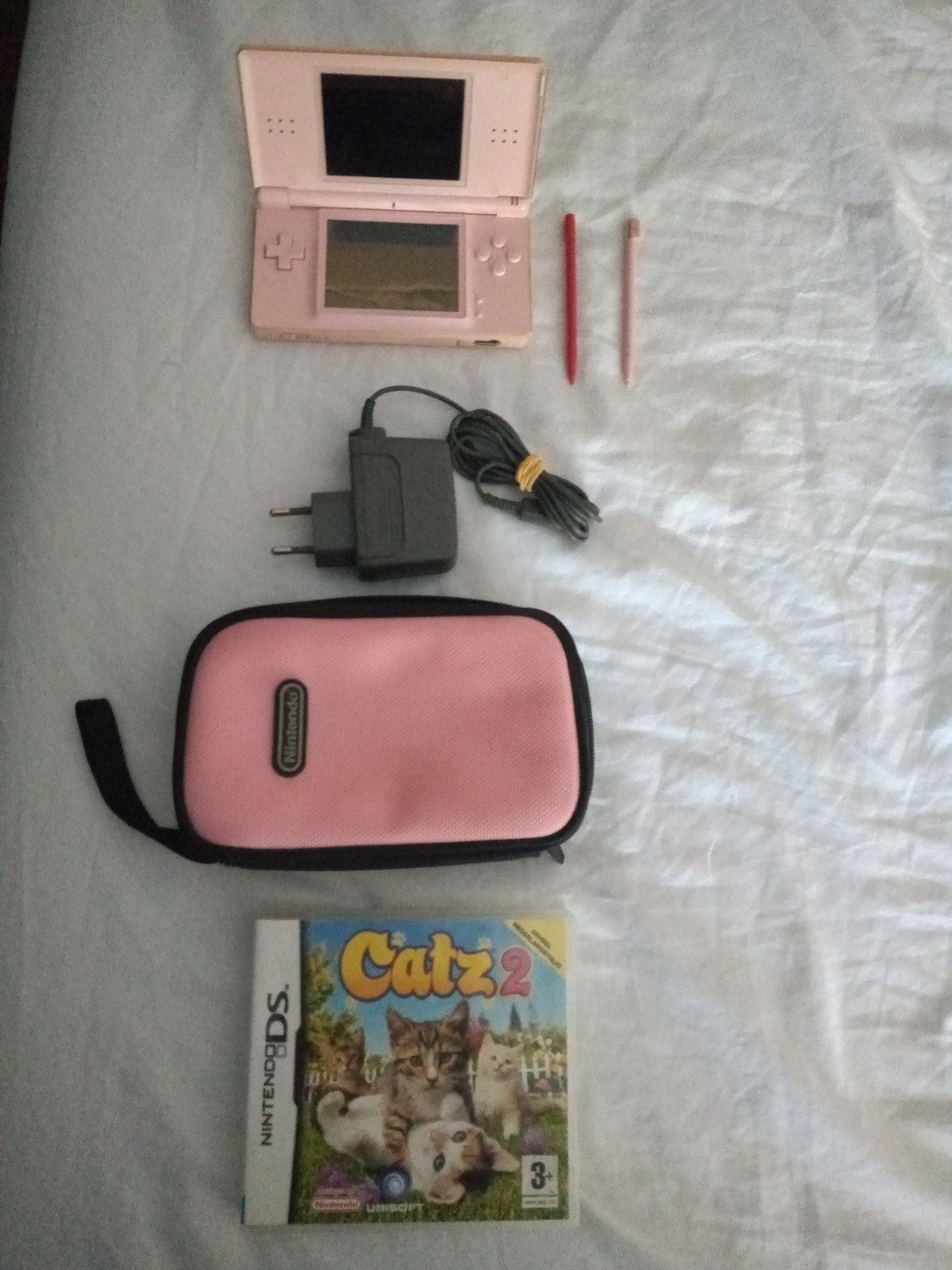 Nintendo DS Lite roze met spel, hoesje en extra pen, Gebruikt, Ophalen of Verzenden, Roze, Met beschermhoes of tas