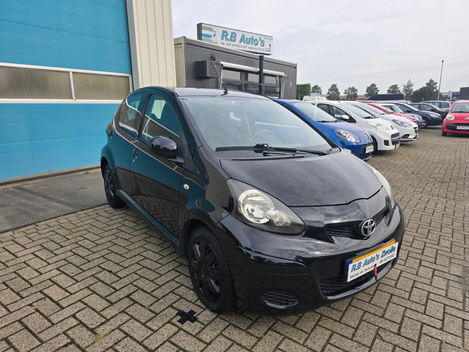 Toyota Aygo 1.0 12V Vvt-i 5DRS 2009 Zwart, Auto's, Voorwielaandrijving, Stof, Zwart, 4 stoelen