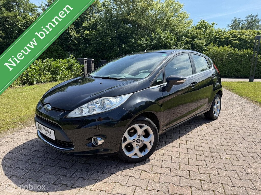 Ford Fiesta 1.25 Titanium, Clima Boordcomputer, Lichtmetaal, Auto's, Voorwielaandrijving, 1242 cc, 82 pk, Zwart