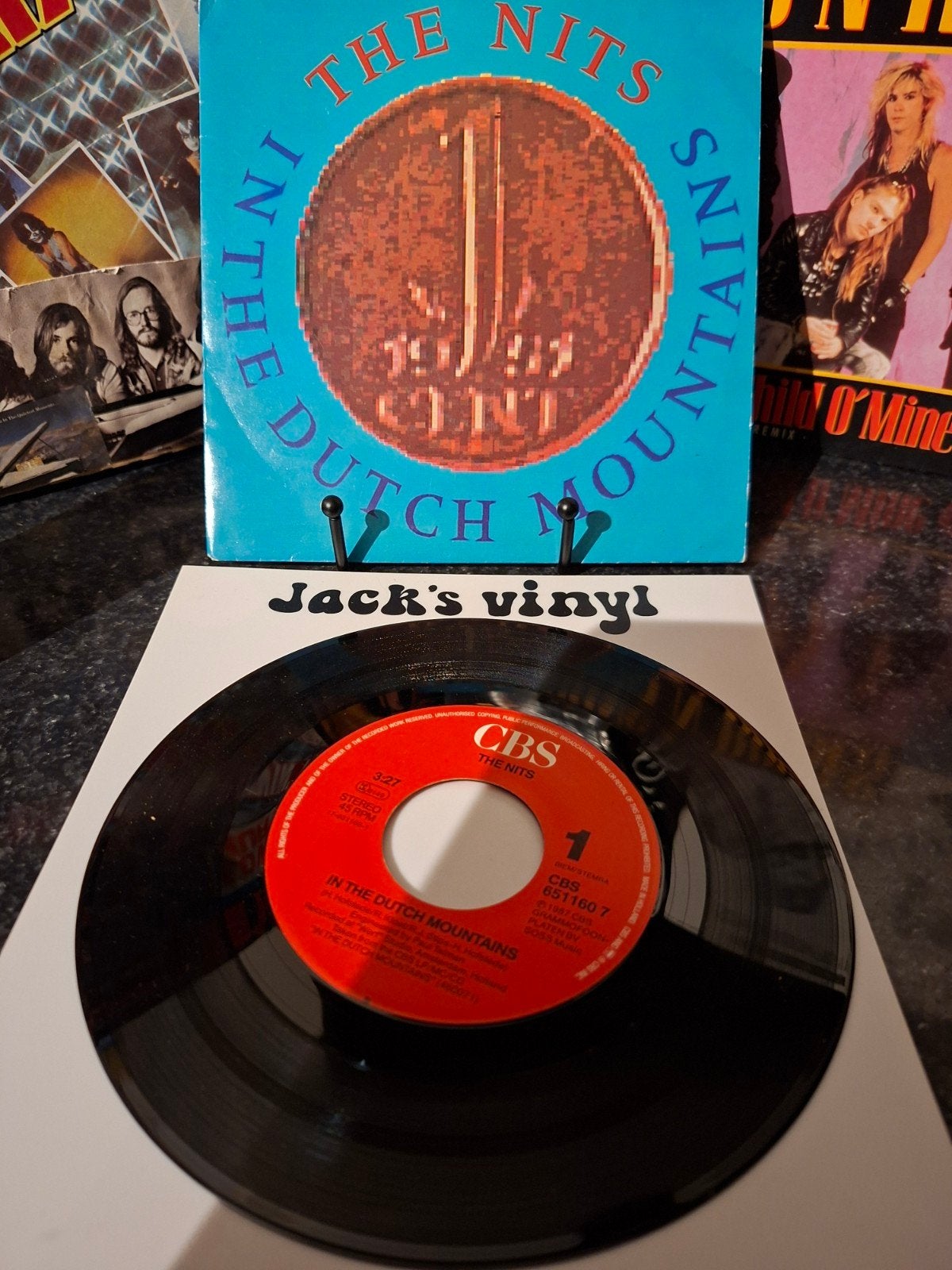 The Nits - In The Dutch Mountains 7 inch single 1987, 7 inch, Ophalen of Verzenden, Overige typen, Fotohoes