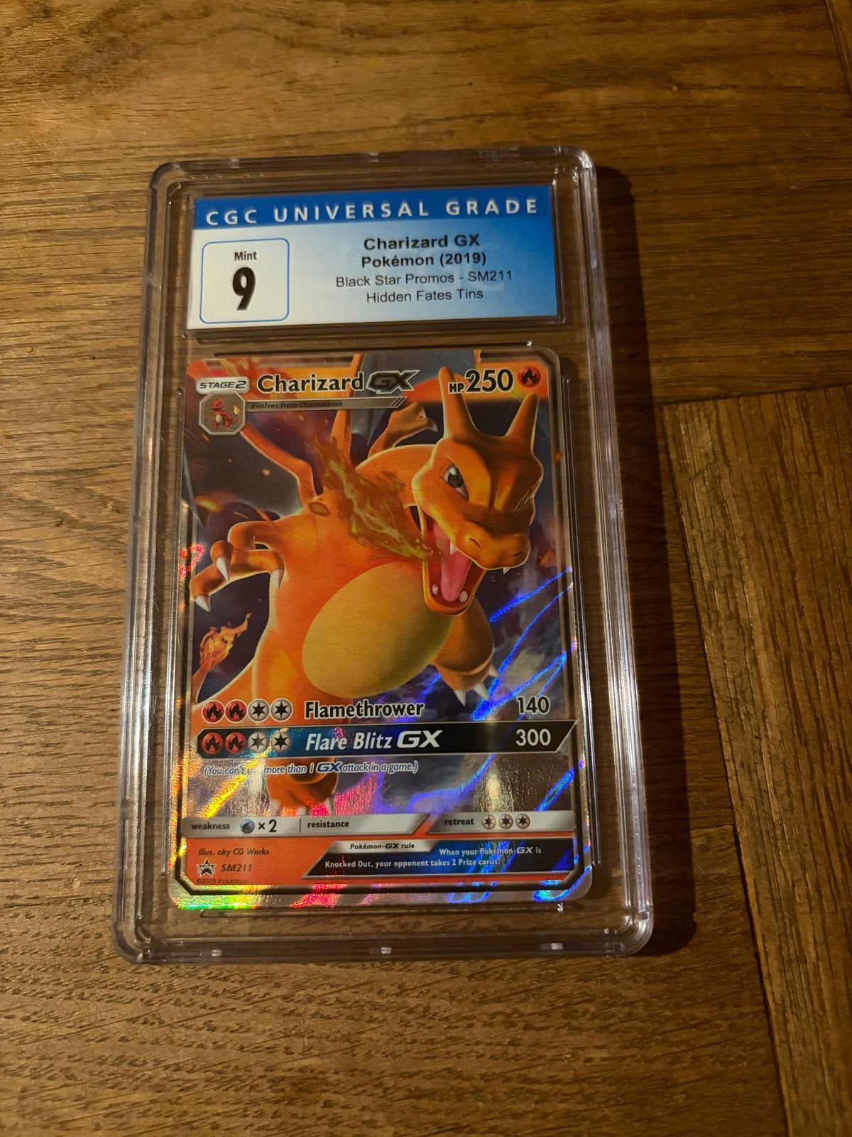 Charizard GX CGC Mint 9 - Black Star Promos SM211, Ophalen of Verzenden, Zo goed als nieuw, Losse kaart, Foil