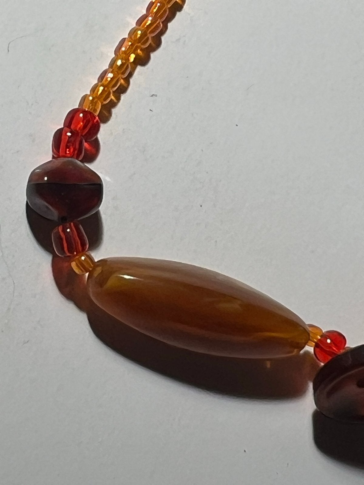 Kleurrijke kralenketting - Oranje, Rood, Bruin, Ophalen of Verzenden, Zo goed als nieuw, Oranje, Kunststof