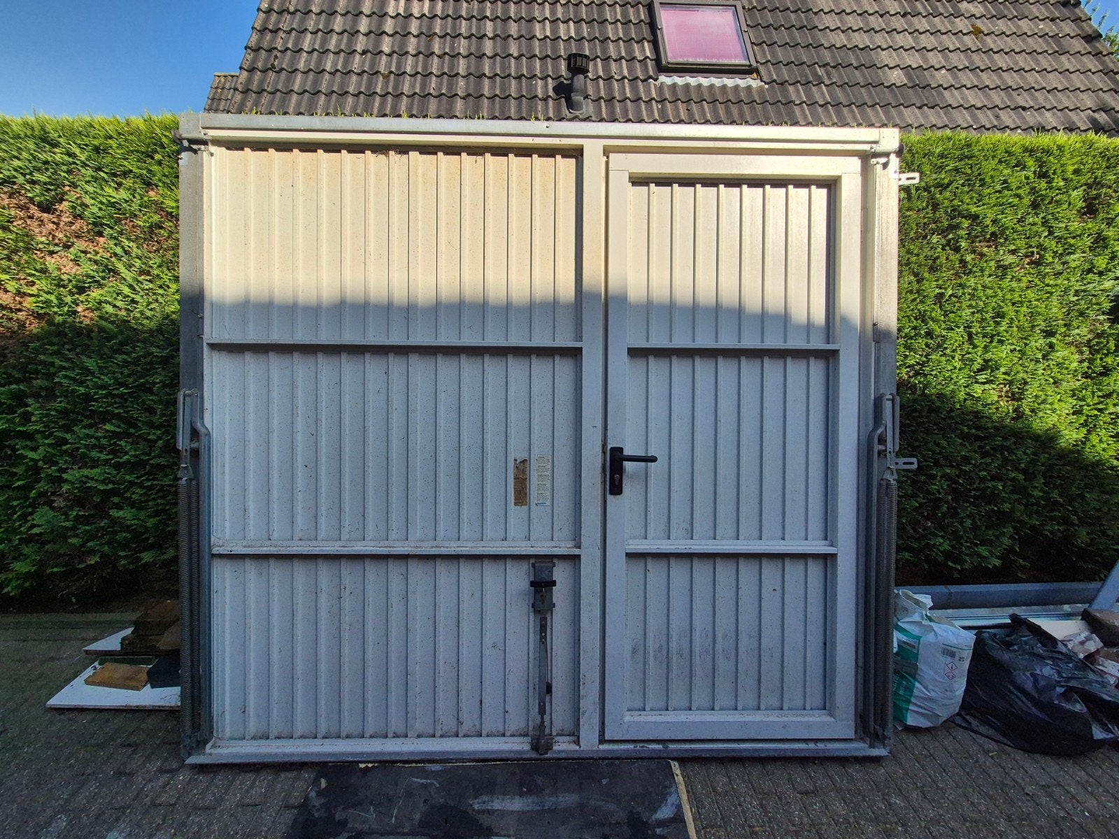 Garagedeur met loopdeur 219x246,5 cm, Ophalen, Gebruikt, 120 cm of meer, Garagedeur