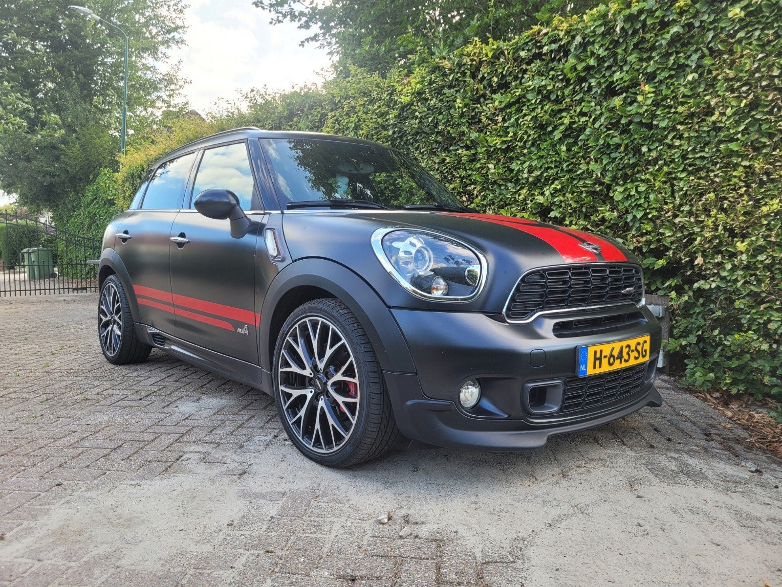 Mini Countryman 1.6 John Cooper Works AUT 2014 Zwart, Auto's, Mini, Zwart, Navigatiesysteem, Zwart, Leder