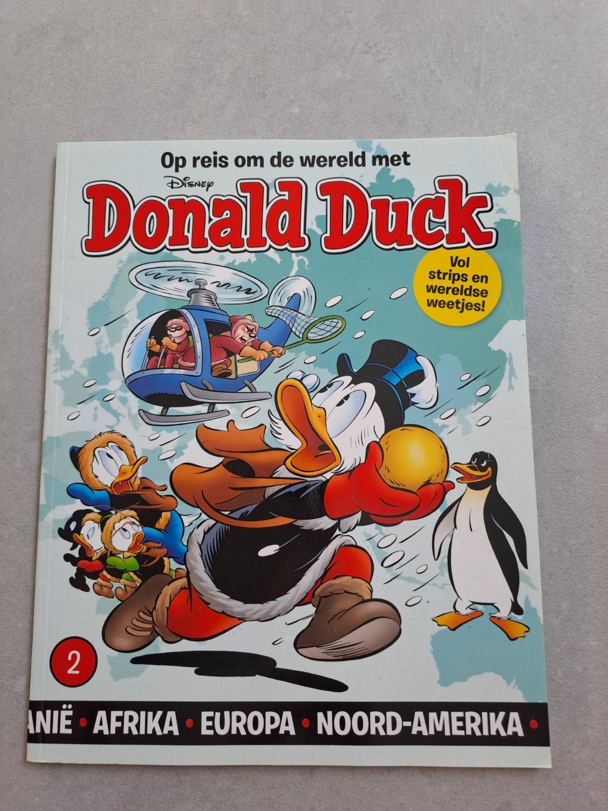 Donald Duck: Op reis om de wereld met Donald Duck deel 2, Eén stripboek, Ophalen of Verzenden, Zo goed als nieuw, Walt Disney
