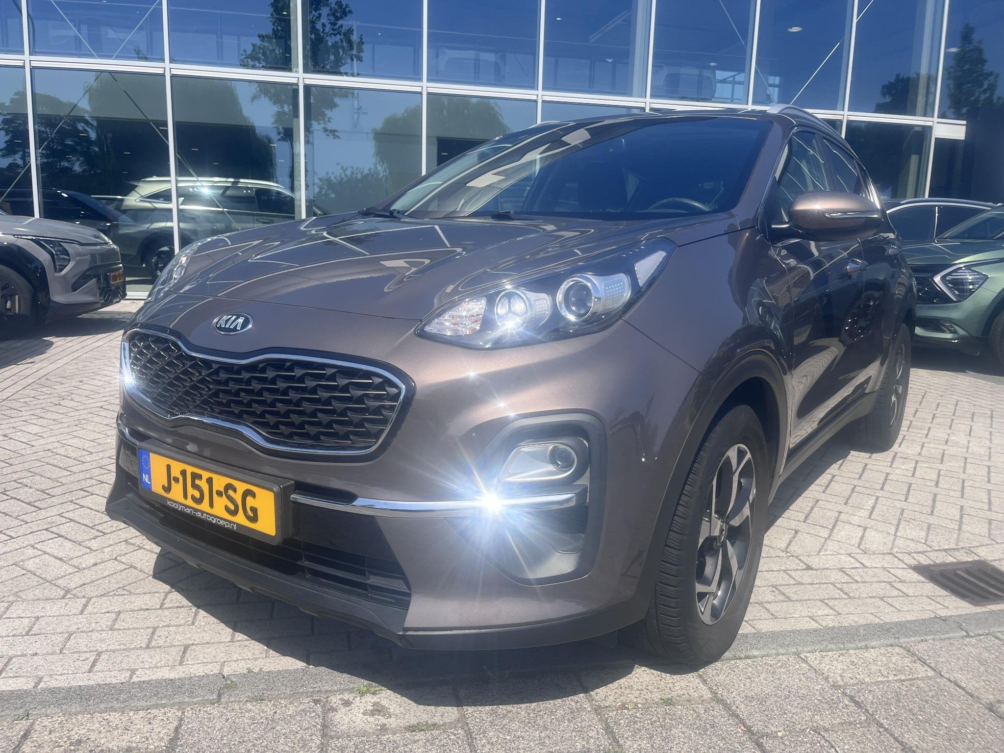 Kia Sportage 1.6 T-GDI DynamicLine Automaat|Nav|Camera|Lmv, Gebruikt, Bruin, Origineel Nederlands, 1600 kg
