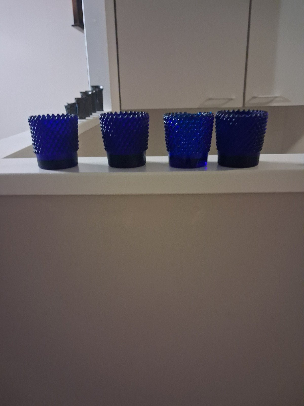 Set van 4 blauwe waxinelichthouders, Ophalen of Verzenden, Zo goed als nieuw, Blauw, Waxinelichthouder