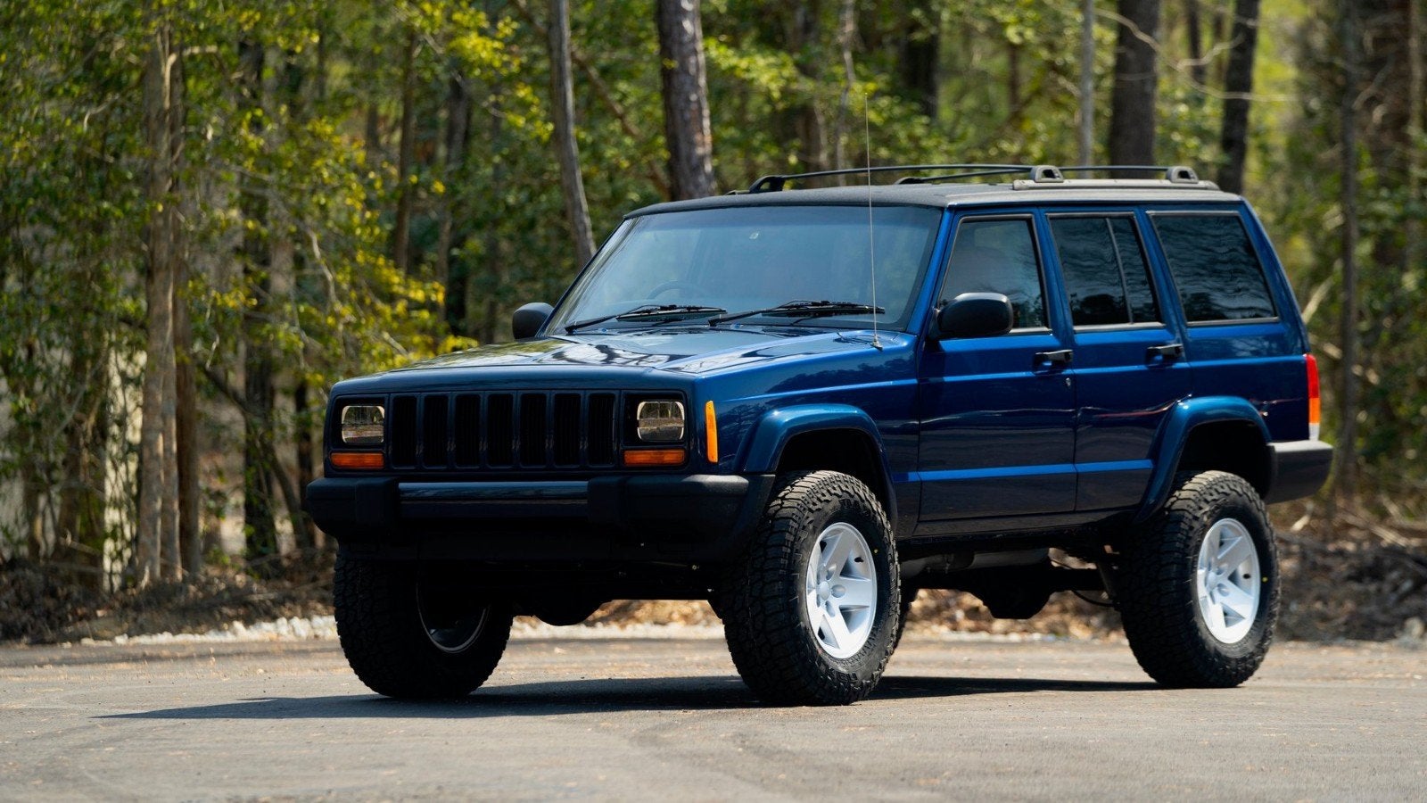 Jeep Cherokee 4.0 I AUT 2000 Blauw, Blauw, Leder en Stof, Origineel Nederlands, Vierwielaandrijving