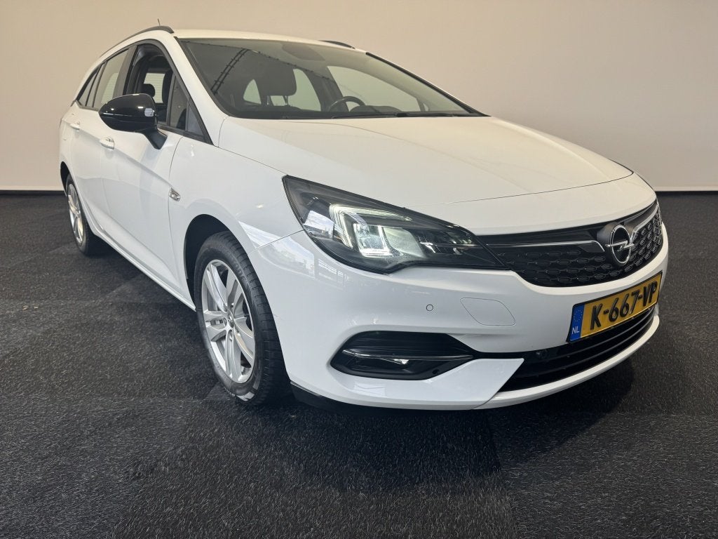 Opel Astra Sports Tourer export only 1.2 Edition (bj 2021), Stof, Gebruikt, Verwarmde buitenspiegels, Wit