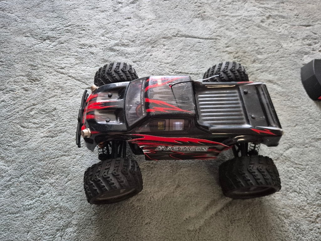 Himoto E18MT 1:18 Mastadon RC Monster Truck Black, Hobby en Vrije tijd, Modelbouw | Radiografisch | Auto's, Gebruikt, Auto offroad