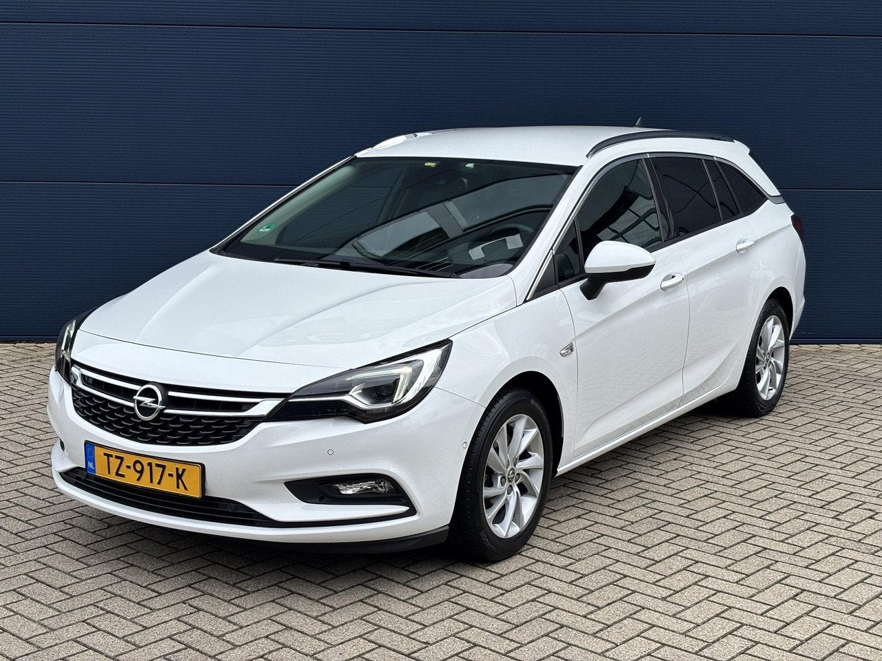 Opel Astra Sports Tourer 1.6 Turbo Innovation 200pk | Naviga, Auto's, Gebruikt, 4 cilinders, Handgeschakeld, 16 km/l