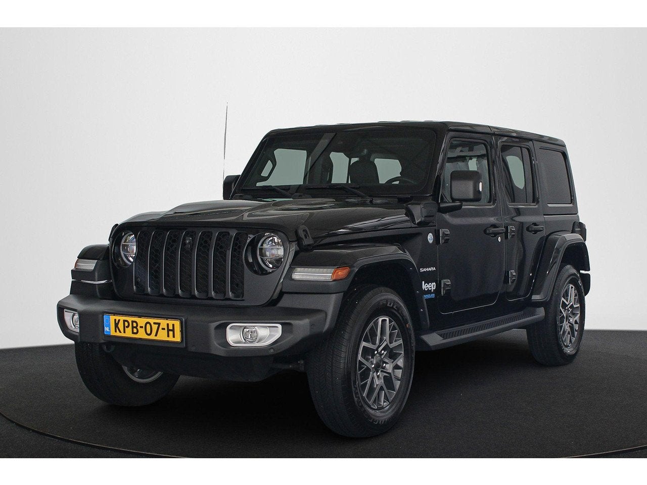 Jeep Wrangler Unlimited 4xe 380 Sahara Leder Stoelverwarming, Auto's, Jeep, Automaat, 4 cilinders, Bedrijf, Hybride Elektrisch/Benzine