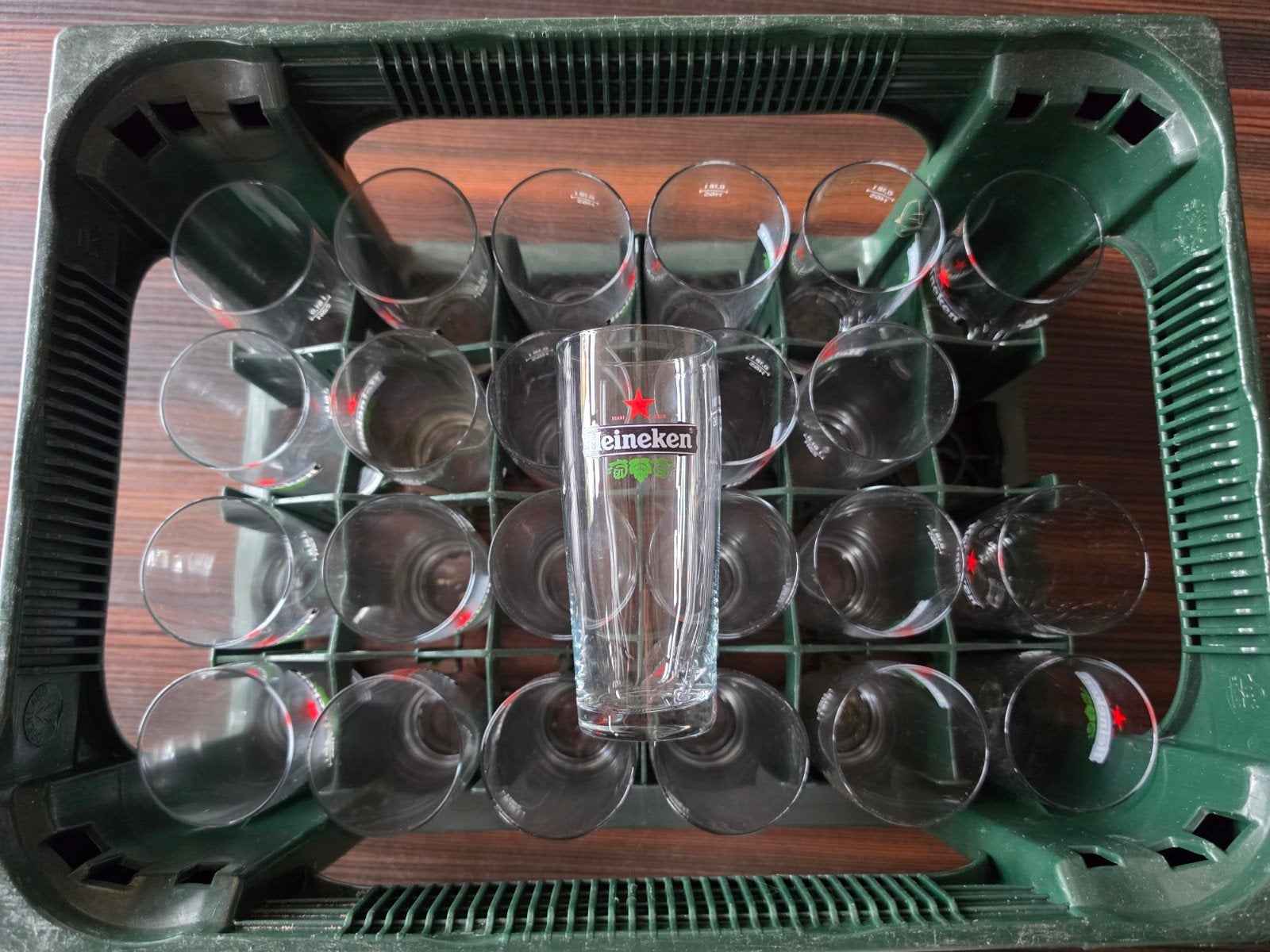 Heineken bierglazen in krat - 24 stuks, Ophalen of Verzenden, Gebruikt, Glas, Overige merken