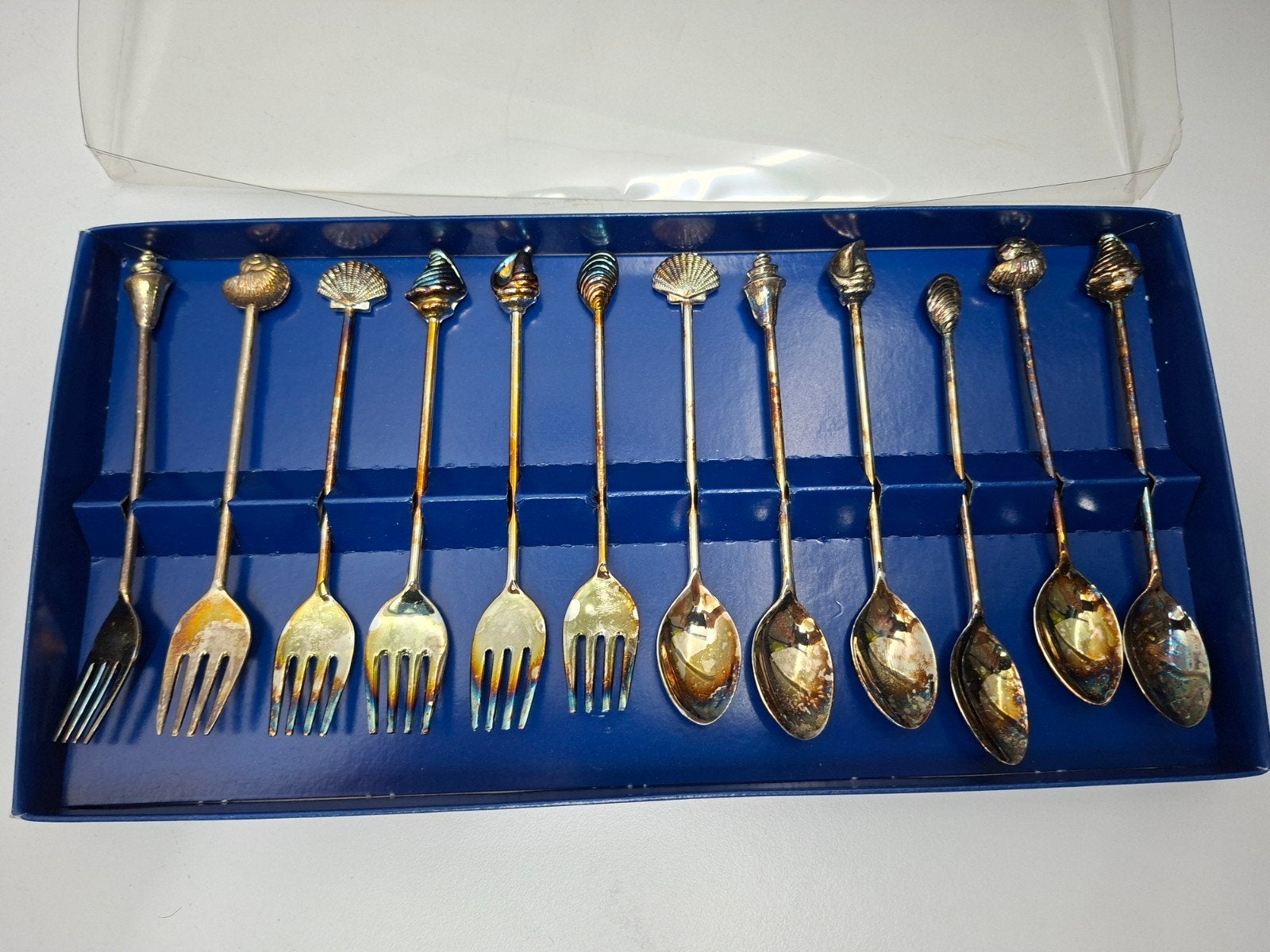 Set van 12 vintage schelpvormige lepels en vorken, Ophalen