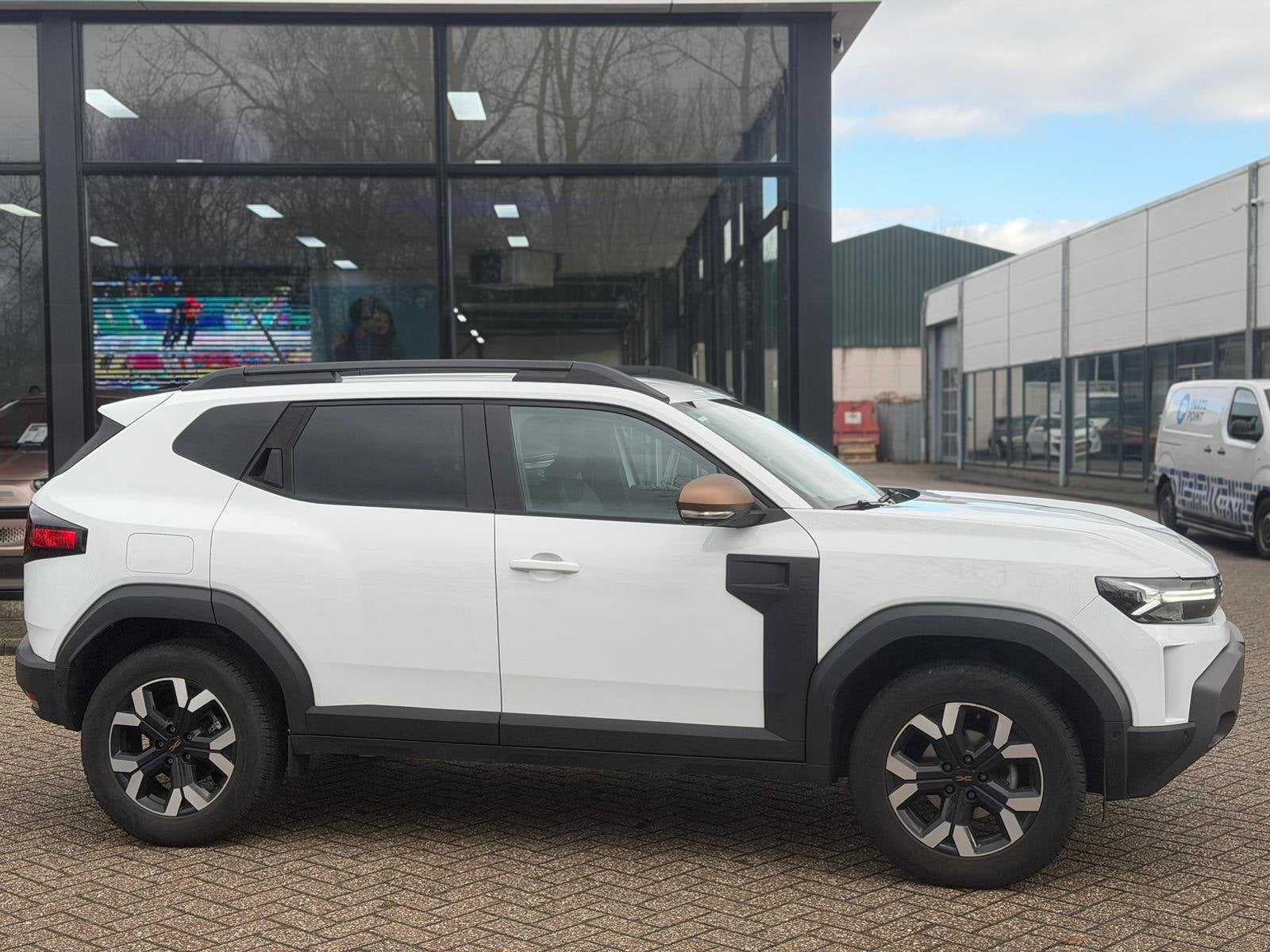 Dacia Duster 1.2 TCe 130 mild hybrid 4x4 Extreme Trekhaak 15, Auto's, Gebruikt, 1199 cc, Duster, Wit