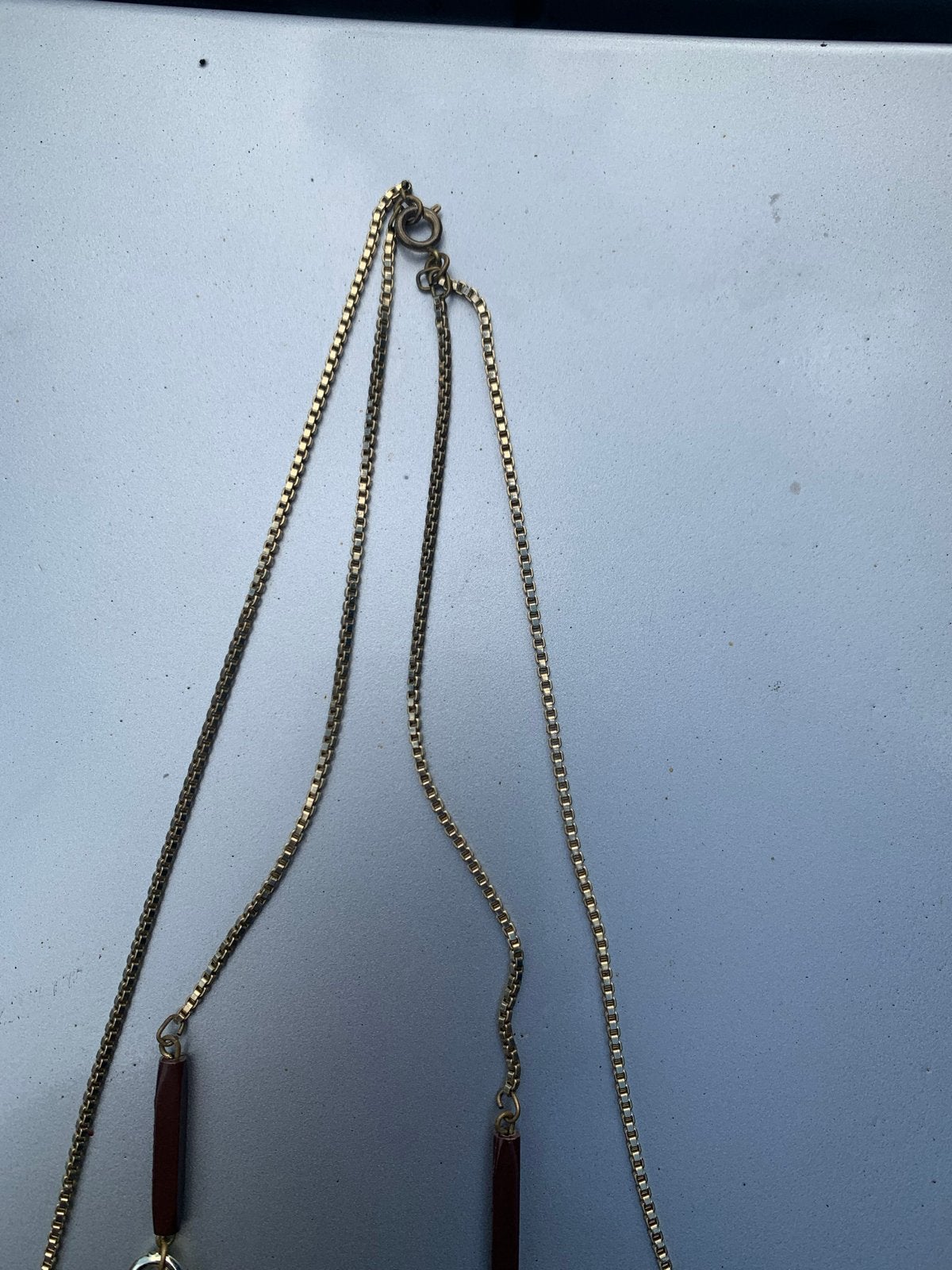 Lange ketting met goudkleurige schakels en bruine kralen, Ophalen of Verzenden, Gebruikt, Goud, Overige materialen