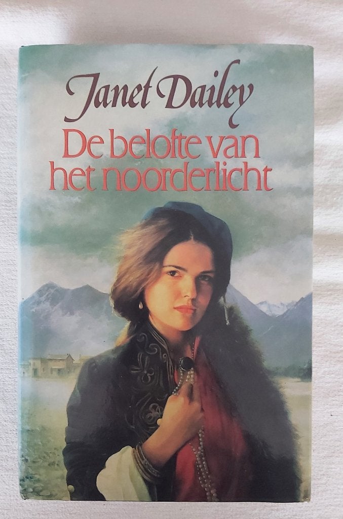 De belofte van het noorderlicht. Janet Dailey, Ophalen of Verzenden, Gelezen