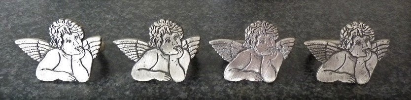 4 Engeltjes servetringen, Ophalen of Verzenden, Zo goed als nieuw, Zilver, Metaal