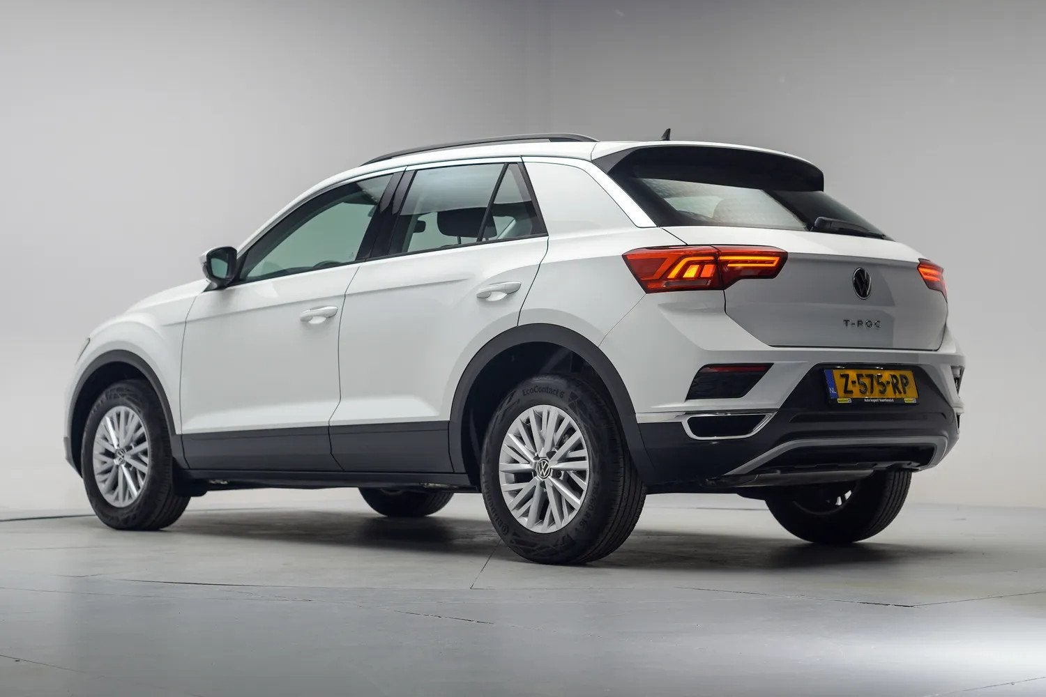Volkswagen T-Roc 1.0 TSI Style Business [ Stoelverwarming Ad, Auto's, Gebruikt, 1194 kg, Wit, Bedrijf