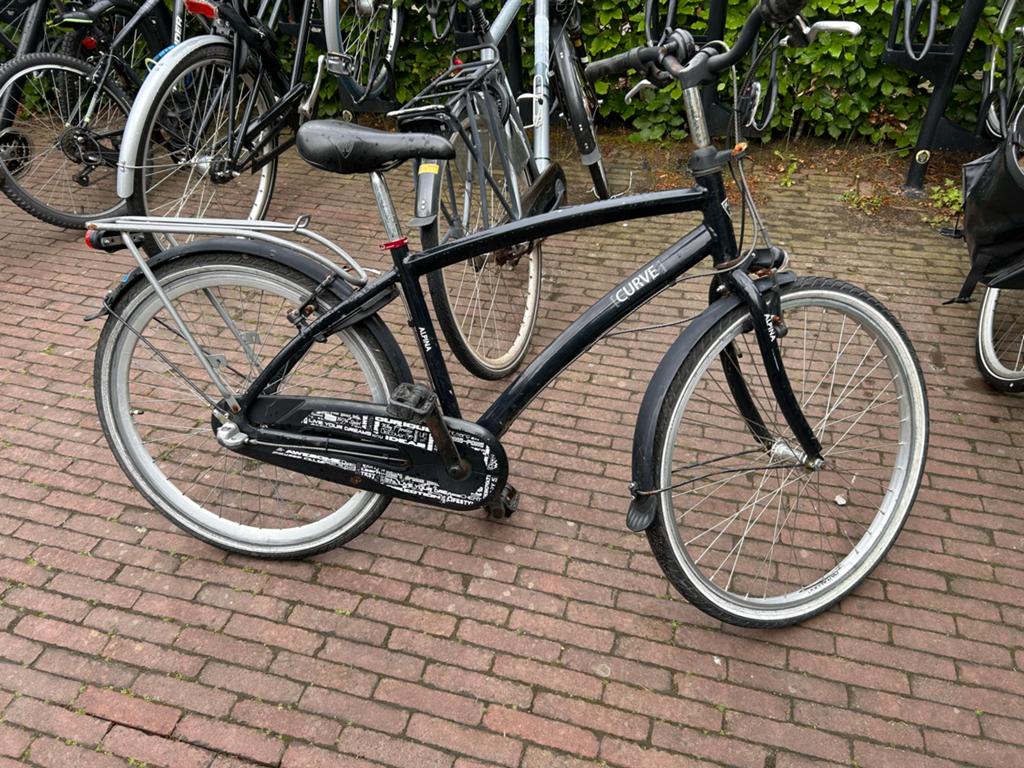 Zwarte Alpina Curve fiets met bagagedrager 26 inch, Fietsen en Brommers, Fietsen | Cruisers en Lowriders, Ophalen, Gebruikt, Staal