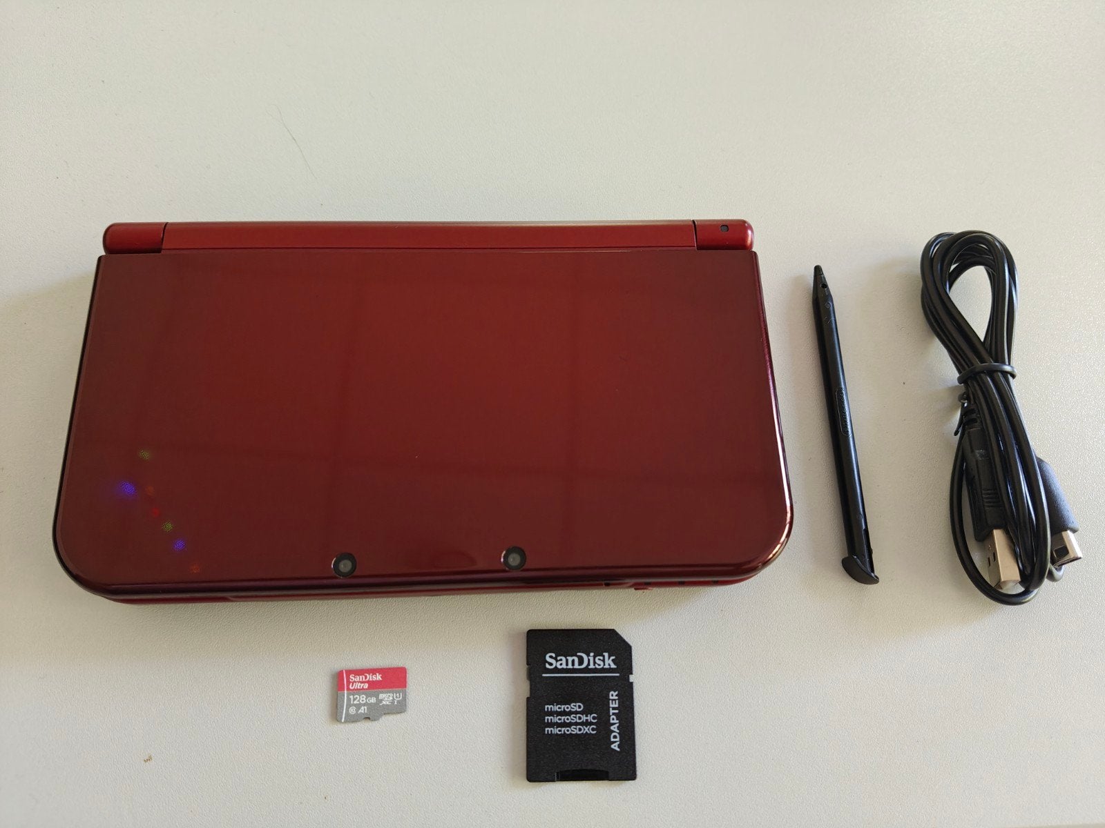 New Nintendo 3DS XL Metallic Red Zeldzaam Dual IPS 128GB san, Spelcomputers en Games, Spelcomputers | Nintendo 2DS en 3DS, Ophalen of Verzenden