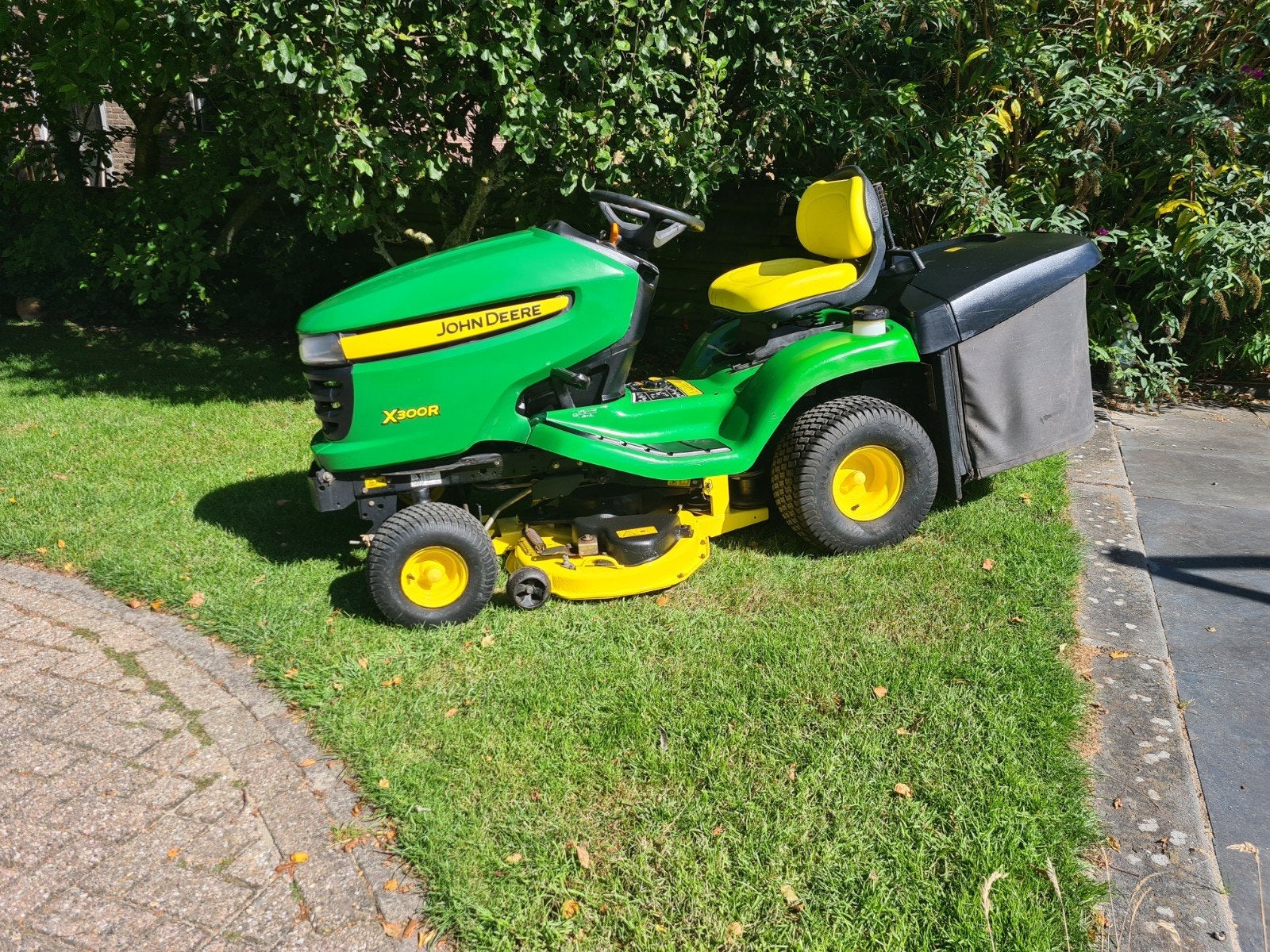 John deere x300r met opvangbak, Ophalen